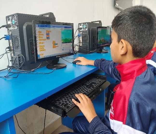 Kids learning Scratch
